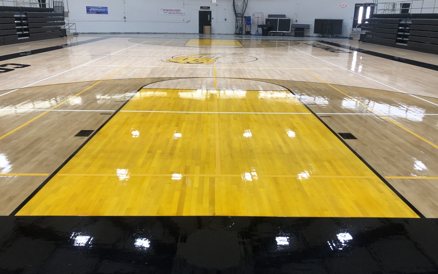 High-quality hardwood gymnasium floor designed for basketball and multi-sport use, showcasing durable maple construction and professional performance.